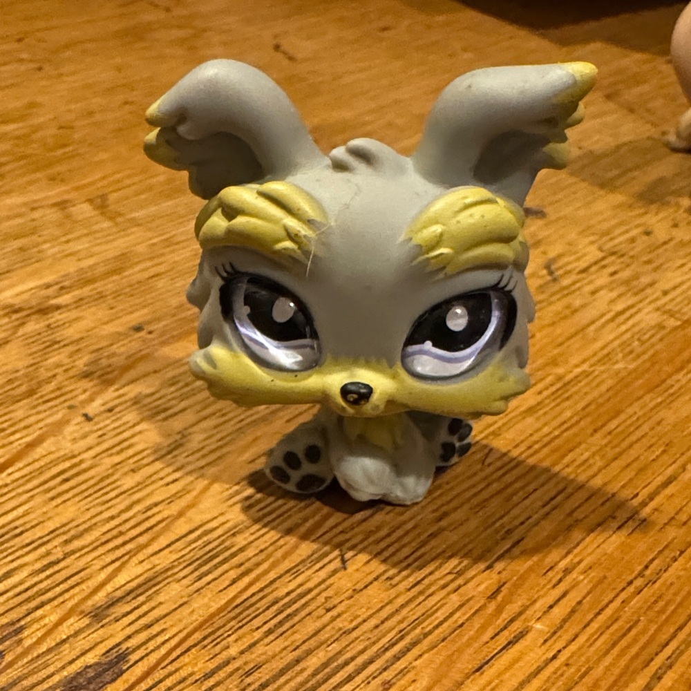 Gray and Yellow Toy Figure